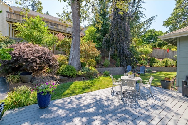 wooden deck with a yard