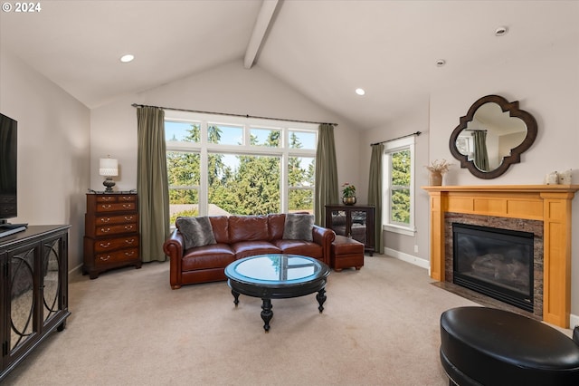 living room with light carpet, vaulted ceiling with beams, and a fireplace