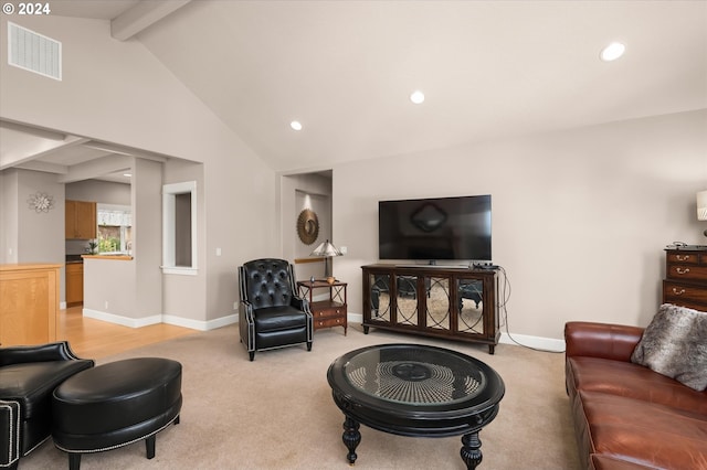 living room featuring beamed ceiling, light colored carpet, and high vaulted ceiling