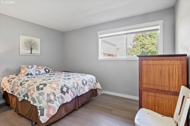 bedroom with hardwood / wood-style floors