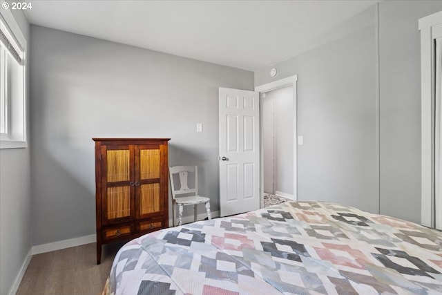 bedroom with hardwood / wood-style floors