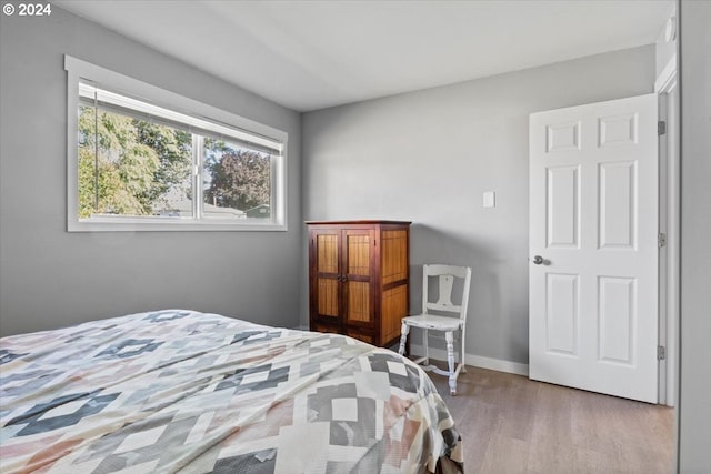 bedroom with wood-type flooring