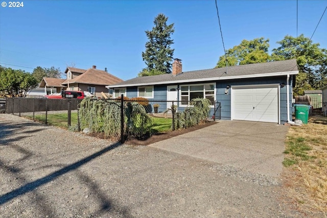 ranch-style home featuring a garage