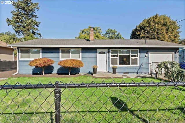 single story home featuring a garage and a front lawn