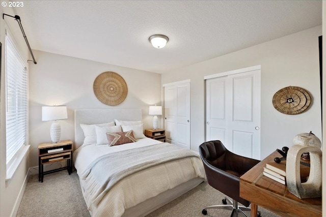 carpeted bedroom with a textured ceiling