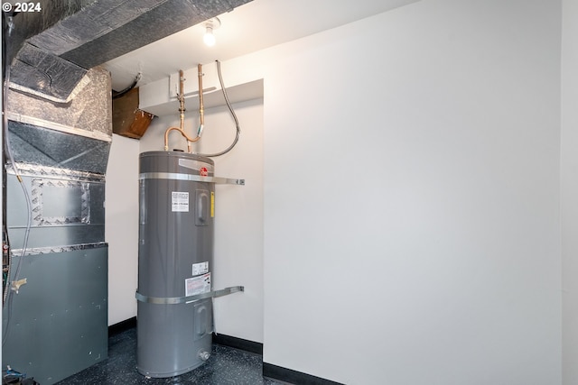 utility room featuring strapped water heater