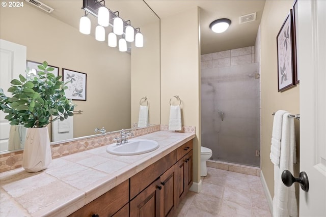 full bath featuring toilet, a stall shower, visible vents, and vanity