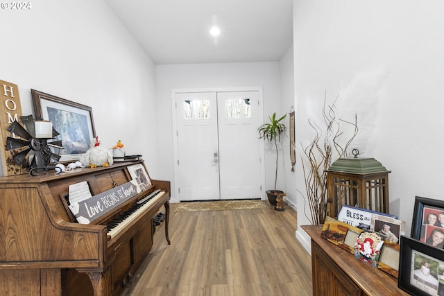 entryway with hardwood / wood-style flooring