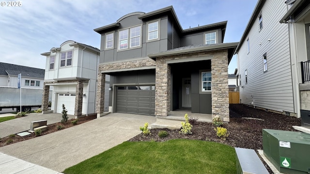 view of front of house featuring concrete driveway, an attached garage, and stone siding