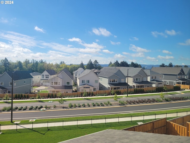 exterior space with fence and a residential view