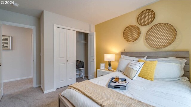 carpeted bedroom with a closet