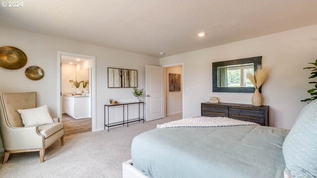 carpeted bedroom with ensuite bathroom