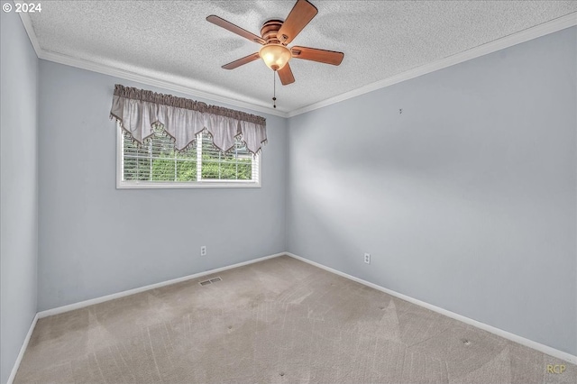 carpeted empty room featuring a textured ceiling, crown molding, and ceiling fan