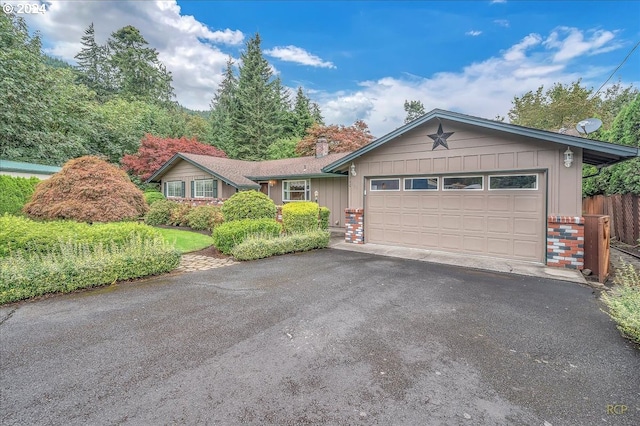 ranch-style home featuring a garage