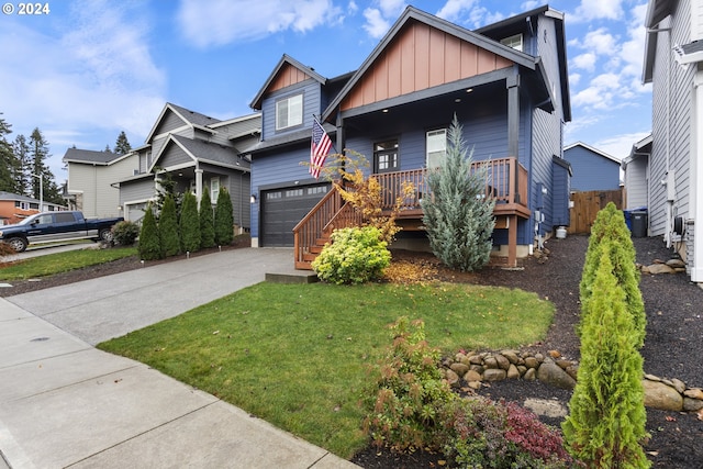 view of front of home featuring covered porch and a garage