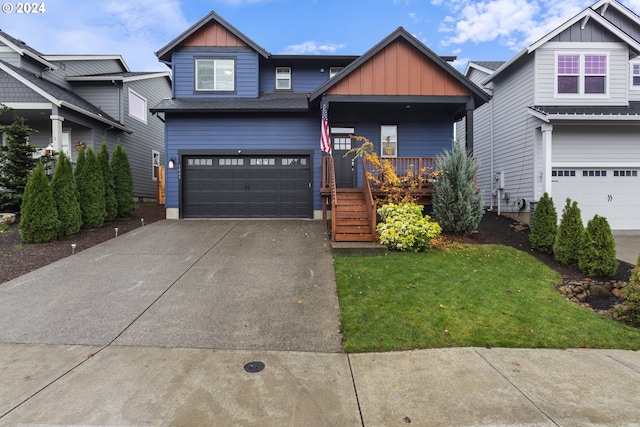 craftsman inspired home with a garage, a porch, and a front yard