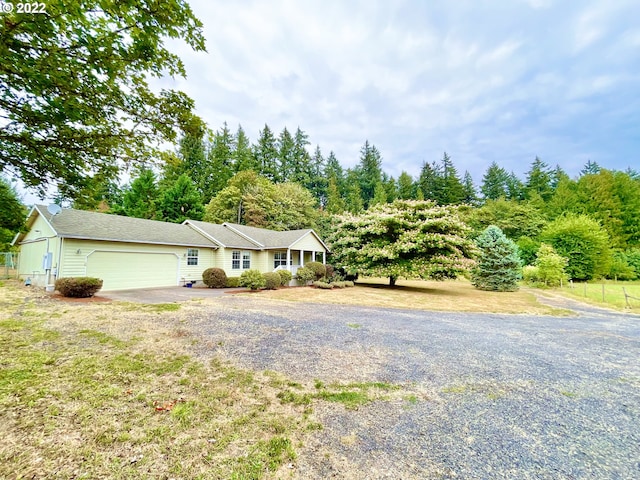 view of front of house featuring a front yard and a garage