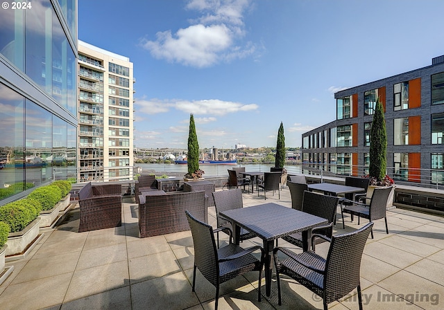 view of patio with a water view