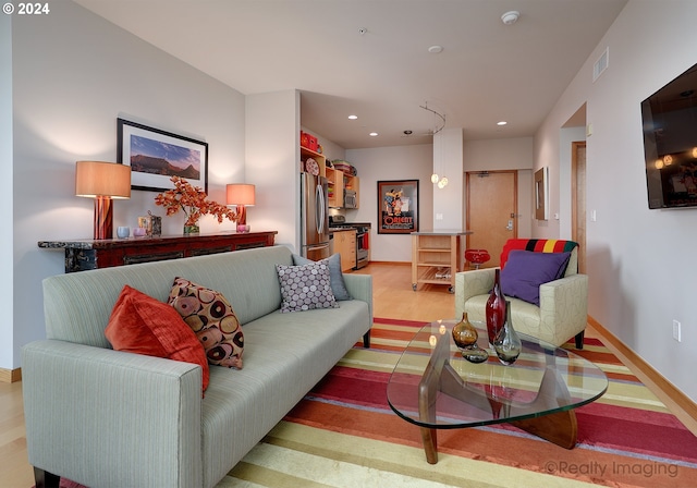 living room with light hardwood / wood-style floors