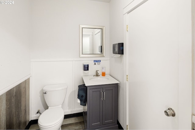 155 E Main St, Lowell, OR 97452 - half bathroom with toilet, vanity, and wainscoting