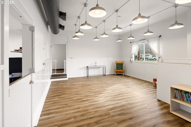 155 E Main St, Lowell, OR 97452 - kitchen featuring wood finished floors, a wainscoted wall, and hanging light fixtures
