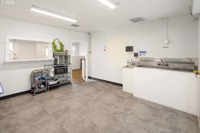 155 E Main St, Lowell, OR 97452 - kitchen with stainless steel counters, white cabinetry, and modern cabinets