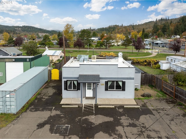 155 E Main St, Lowell, OR 97452 - view of front of house with a fenced backyard, a gate, a residential view, and uncovered parking