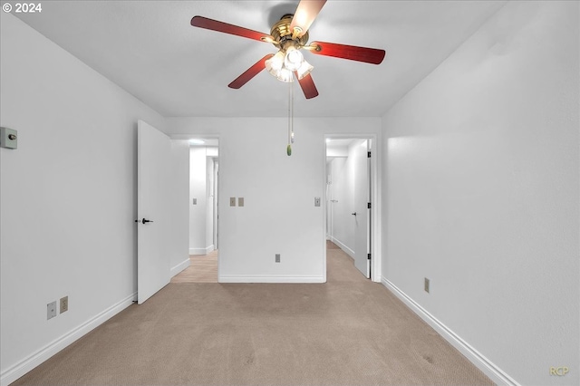 unfurnished bedroom with ceiling fan and light carpet