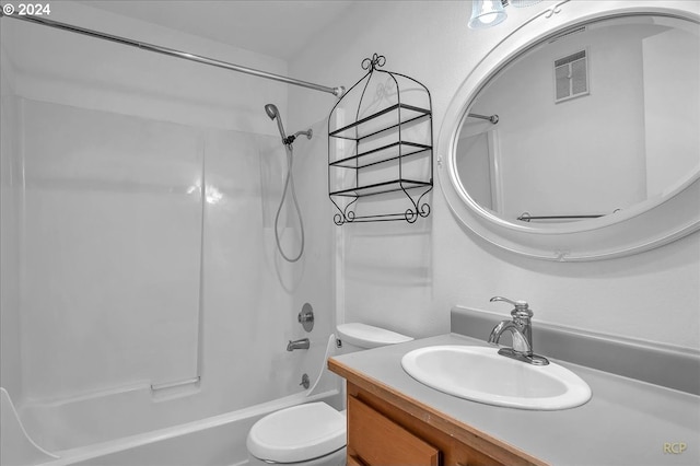 full bathroom with washtub / shower combination, vanity, and toilet