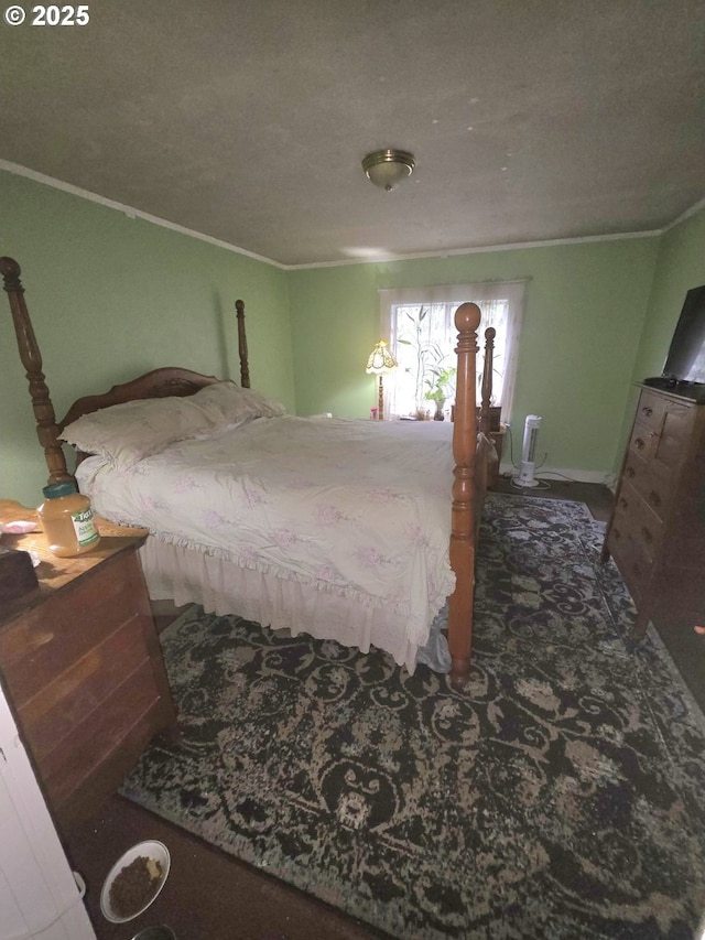 bedroom with crown molding, carpet flooring, and a textured ceiling