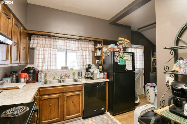 kitchen with black appliances, decorative backsplash, and sink