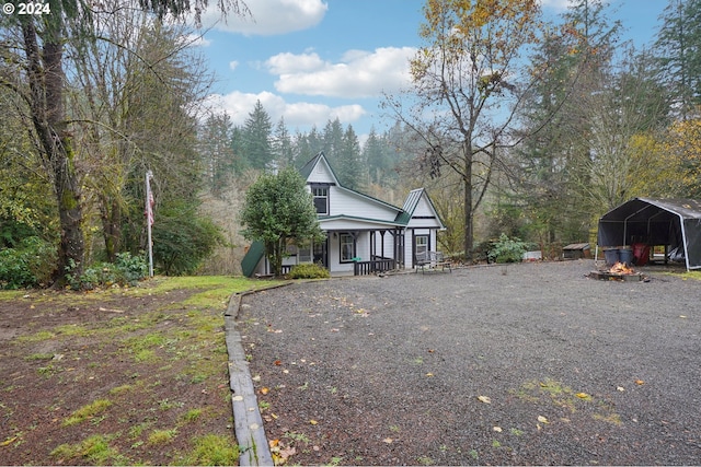 view of front of house with a carport and covered porch