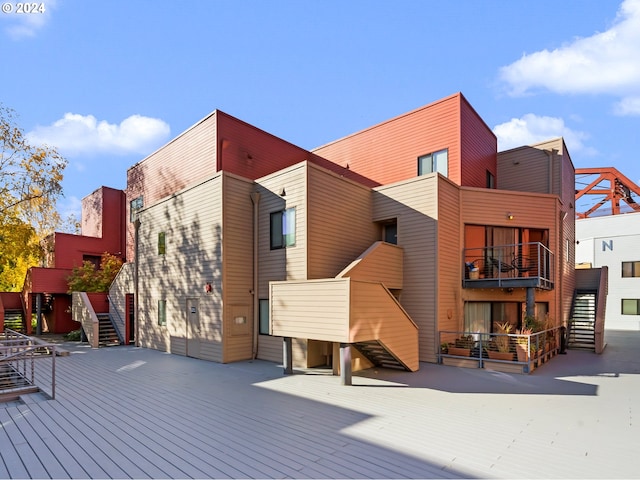 exterior space with a balcony and a deck