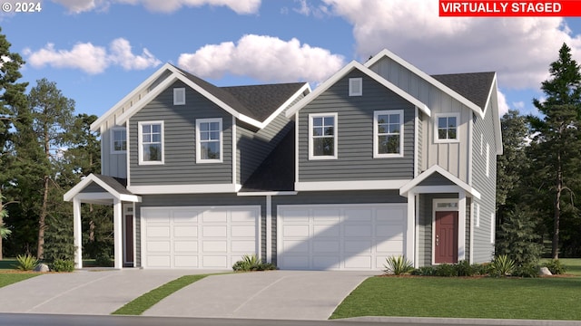 view of front facade featuring a front yard and a garage