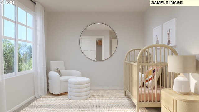 bedroom with a nursery area