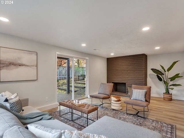 living room featuring a fireplace and hardwood / wood-style flooring