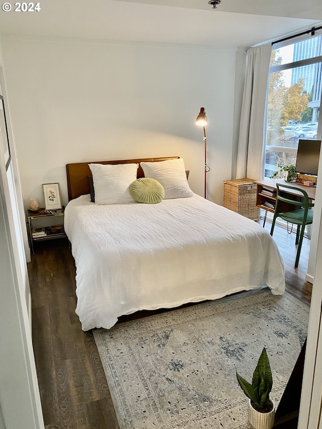 bedroom featuring dark hardwood / wood-style floors