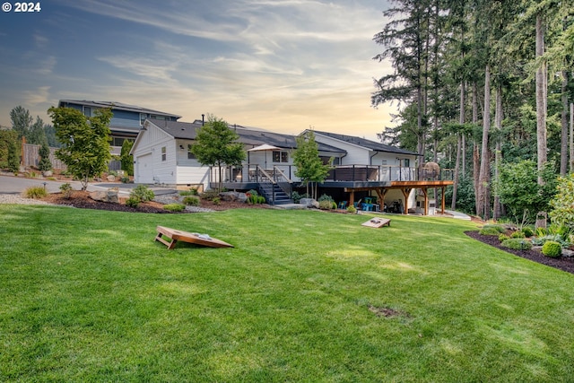 yard at dusk with a wooden deck