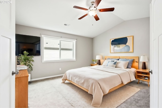 carpeted bedroom with ceiling fan and lofted ceiling