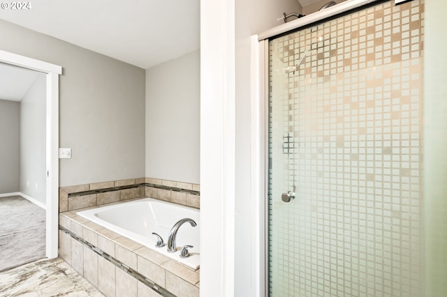 bathroom with separate shower and tub