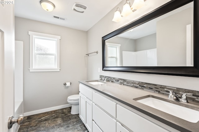 full bathroom featuring vanity, plus walk in shower, and toilet