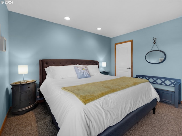 bedroom with dark colored carpet