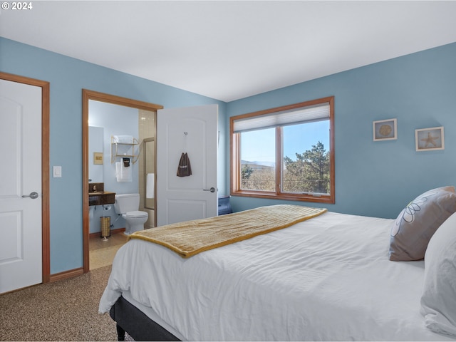 bedroom with carpet flooring and ensuite bathroom