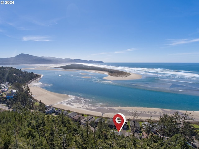 water view featuring a beach view and a mountain view