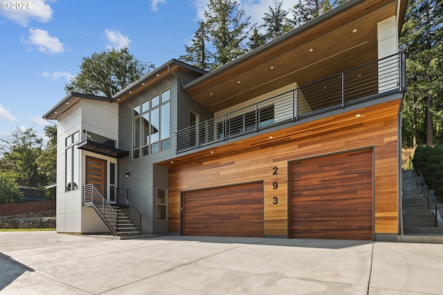 contemporary house with a balcony and a garage