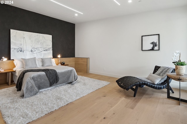 bedroom with light wood-type flooring