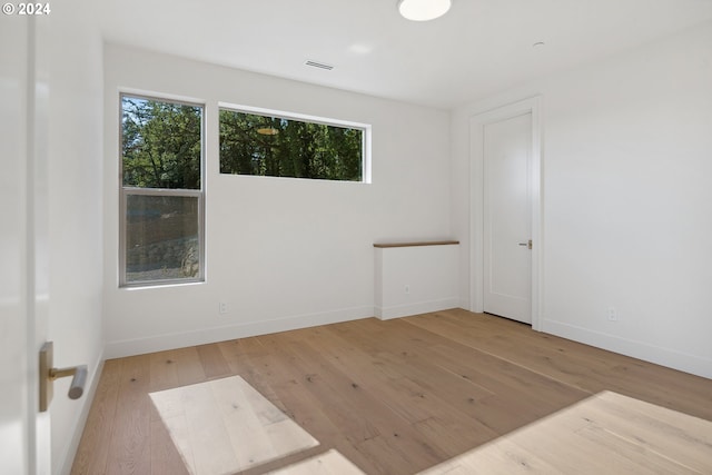 spare room featuring light wood-type flooring