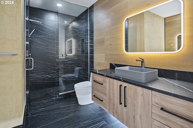 bathroom with vanity, an enclosed shower, and toilet