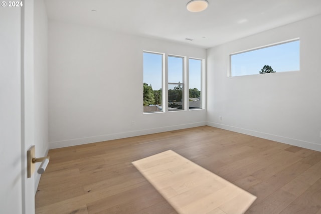 unfurnished room featuring light wood-type flooring