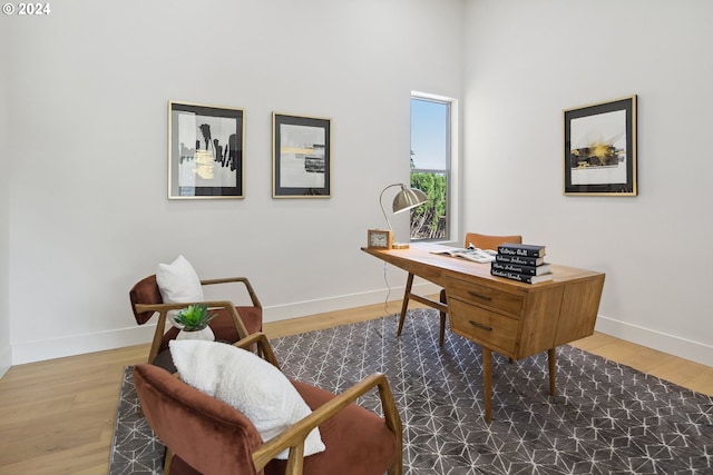 office space with wood-type flooring